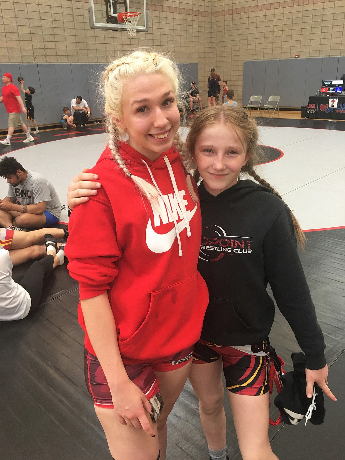 Sandpoint senior Kayelin Johansen (left) and seventh grader Nevaeh Therrien pose for a photo at the USA Wrestling Idaho State Championships last weekend in Twin Falls.