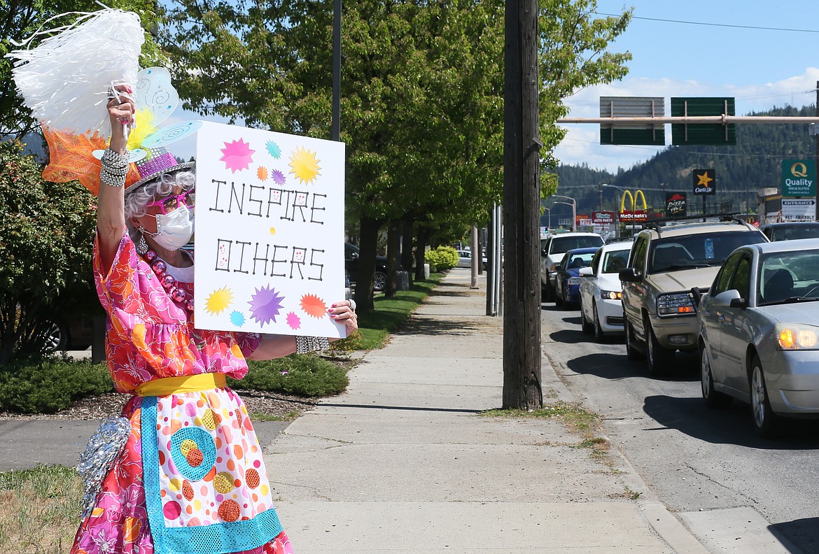 "Inspire others" is the message Red Hot Mama Sarah Parshall sends out into the community Friday as she and Mama colleagues participate in a flash event at the Appleway Avenue and Highway 95 intersection.