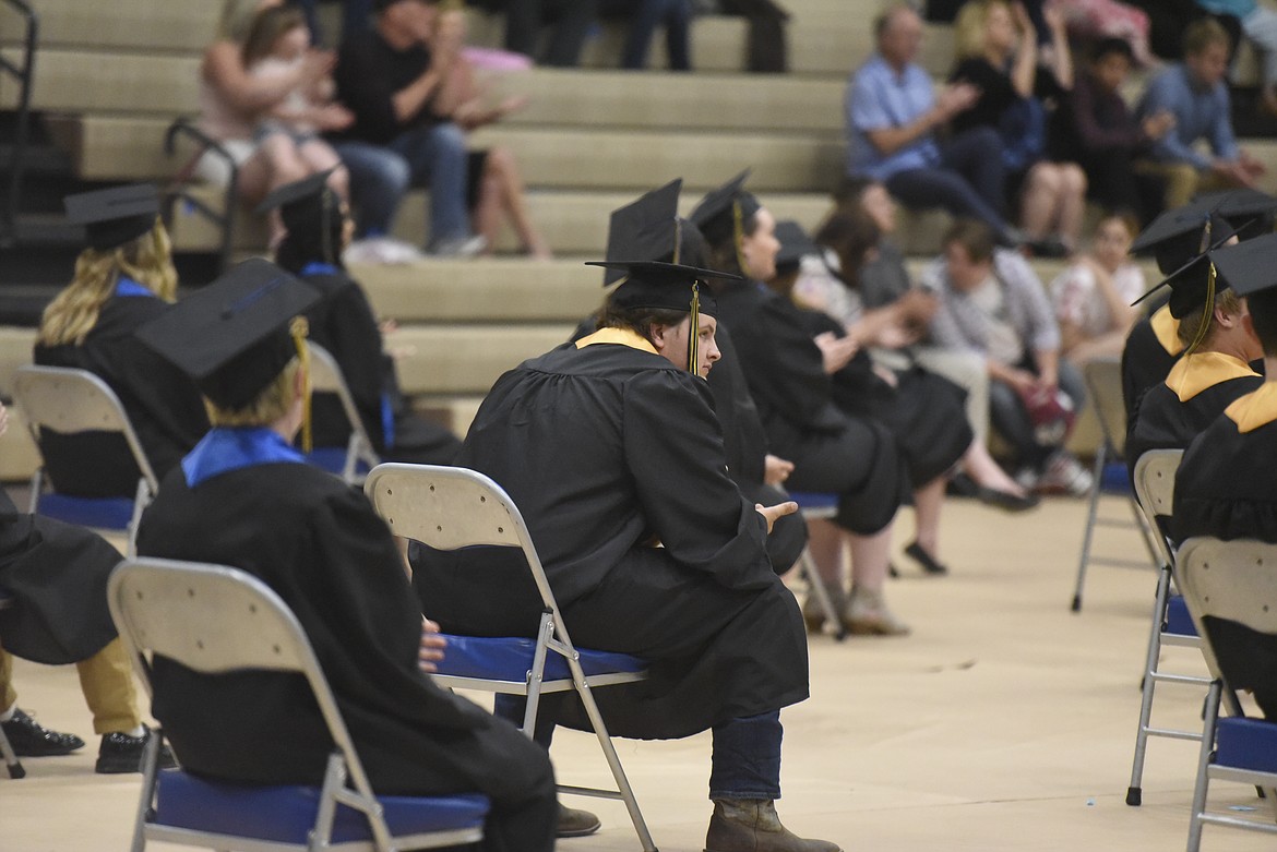 Members of Libby High School's Class of 2020 sit six feet apart during last year's pandemic-restricted ceremonies. (File photo)