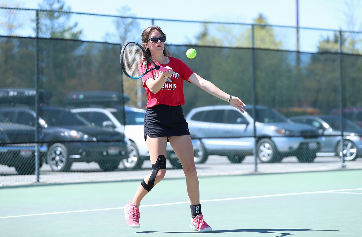 Denali Terry hits a return during the girls doubles regional championship match on Saturday at Travers Park.