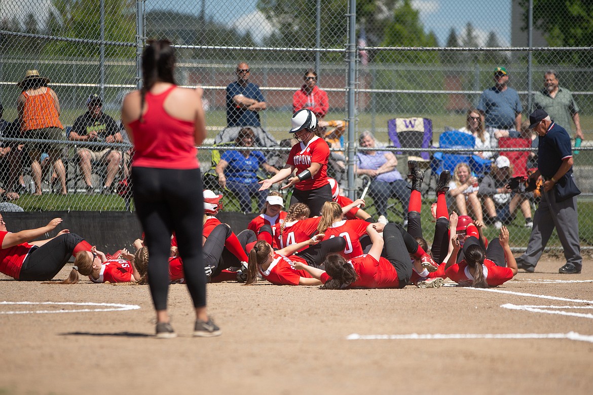 Sandpoint celebrates after Kinzie Ward's homer on Saturday.