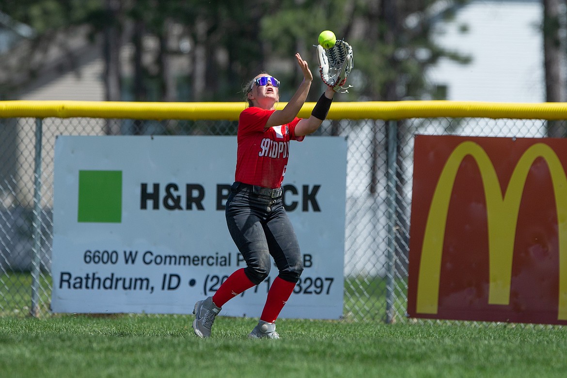 Jacey Cash secures a catch in the outfield during Game 3 of the 4A Region 1 championship series at Lakeland on May 15.