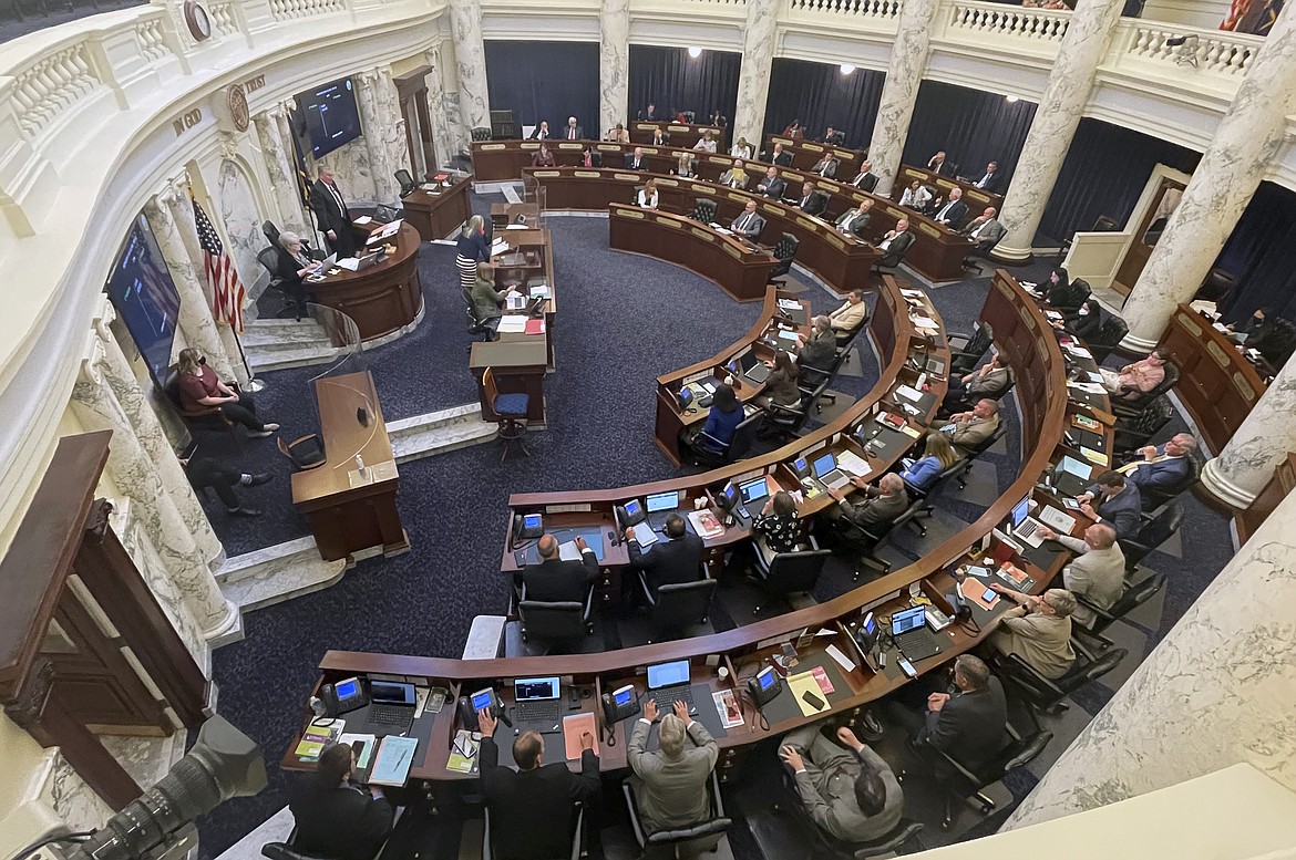 The Idaho House of Representatives works late into the evening at the Statehouse in Boise, Idaho, on Wednesday, May 12, 2021, before finishing the state's longest Legislative session at 122 days. Republican lawmakers say the session resulted in significant income and property tax breaks, but Democratic lawmakers say they mainly benefit the wealthy. (AP Photo/Keith Ridler)