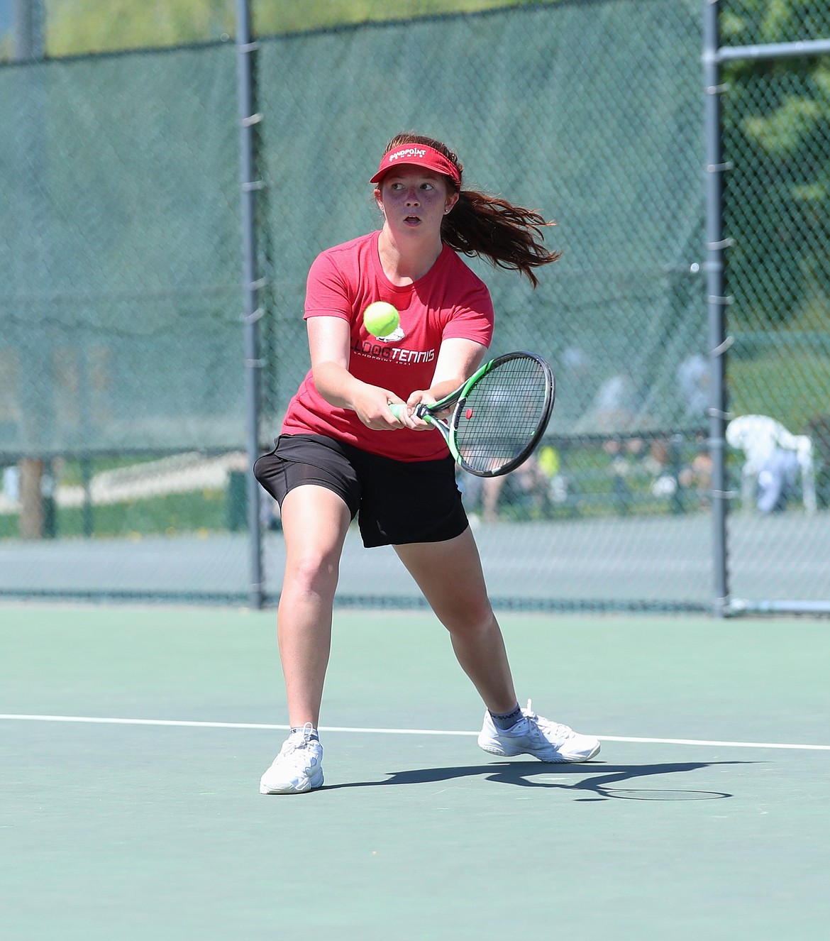 Maise Brazill hits a return during a girls singles regional consolation semifinal match against Adrian Doty on Saturday at Travers Park.