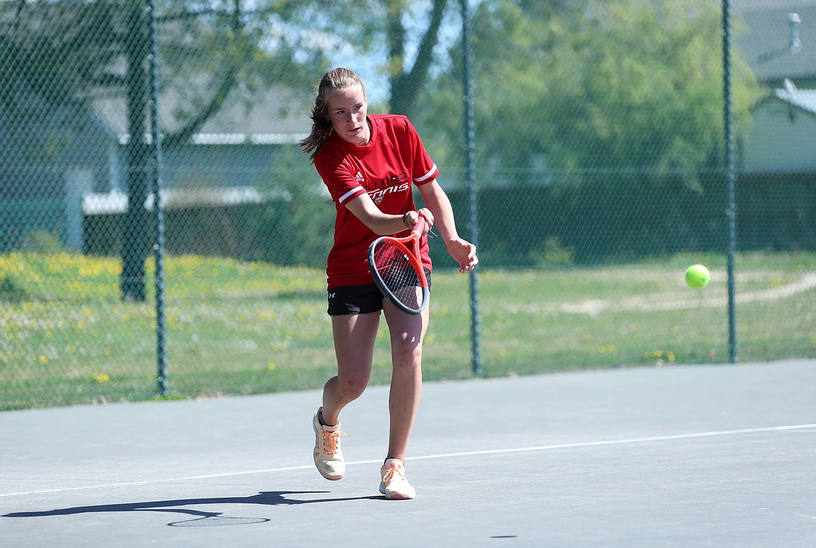 Neva Reseska hits a return during the girls singles regional championship match on Saturday at Travers Park.
