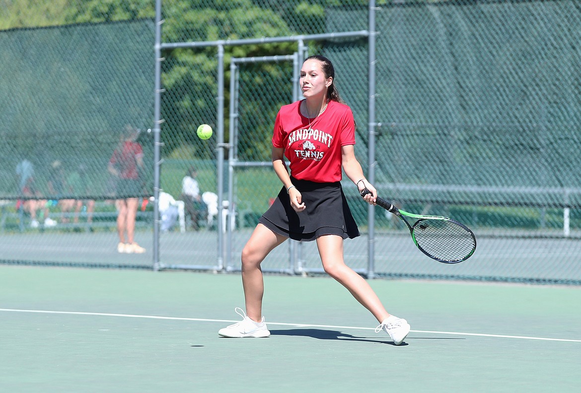 Olivia Petruso returns a serve during the girls doubles regional championship match on Saturday at Travers Park.