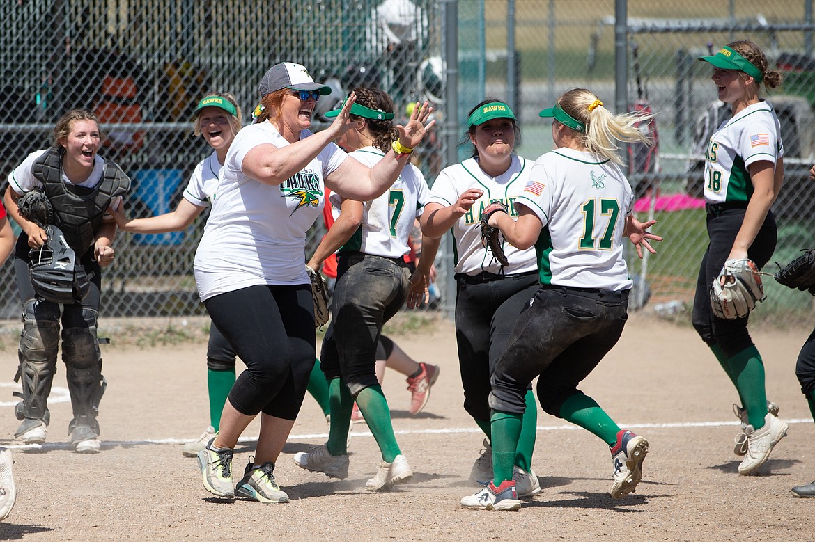 JASON DUCHOW PHOTOGRAPHY
Lakeland High softball coach Colleen Bevacqua celebrates with her players, including Haylee Smit (17), after the Hawks defeated Sandpoint to win the 4A Region 1 softball championship Saturday in Rathdrum.