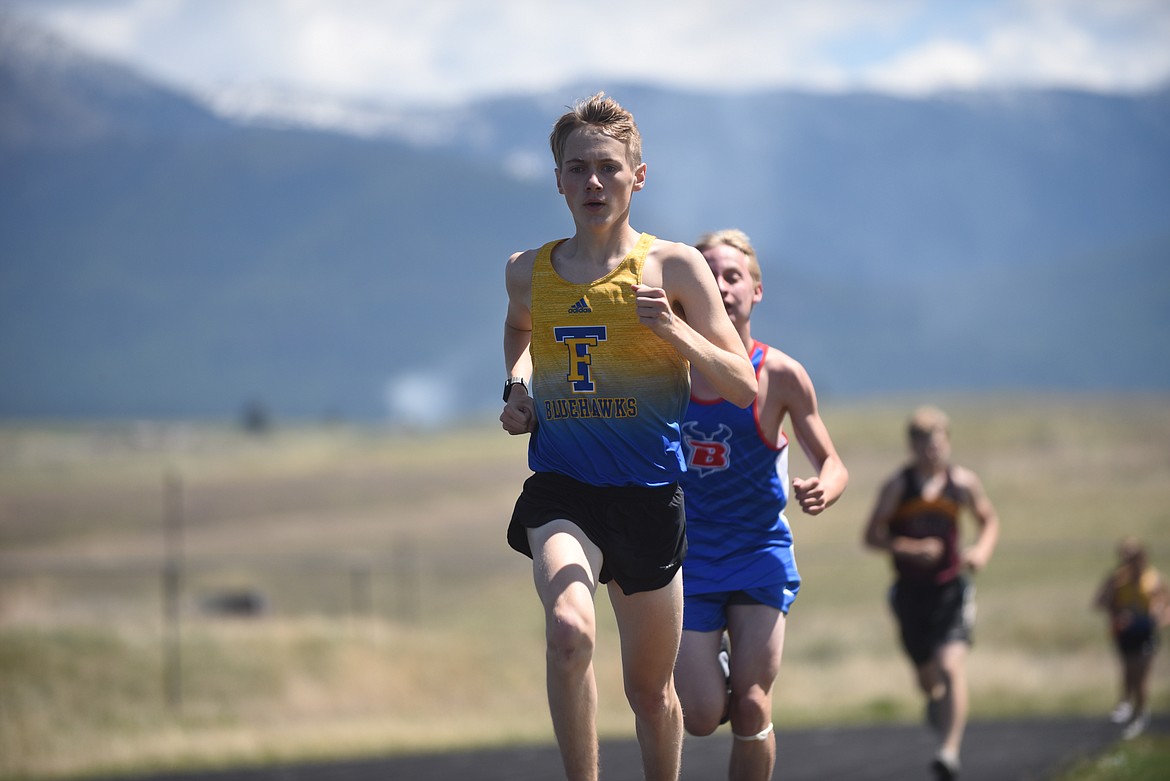 Thompson Falls' Justin Morgan duels with Bigfork's Jack Jensen in the 1,600-meter run Saturday at the 7B District championships in Eureka. Morgan was second in the event, but in the 3,200 run Morgan beat Jensen by nearly a minute. (Photo by Scott Shindledecker/Valley Press)