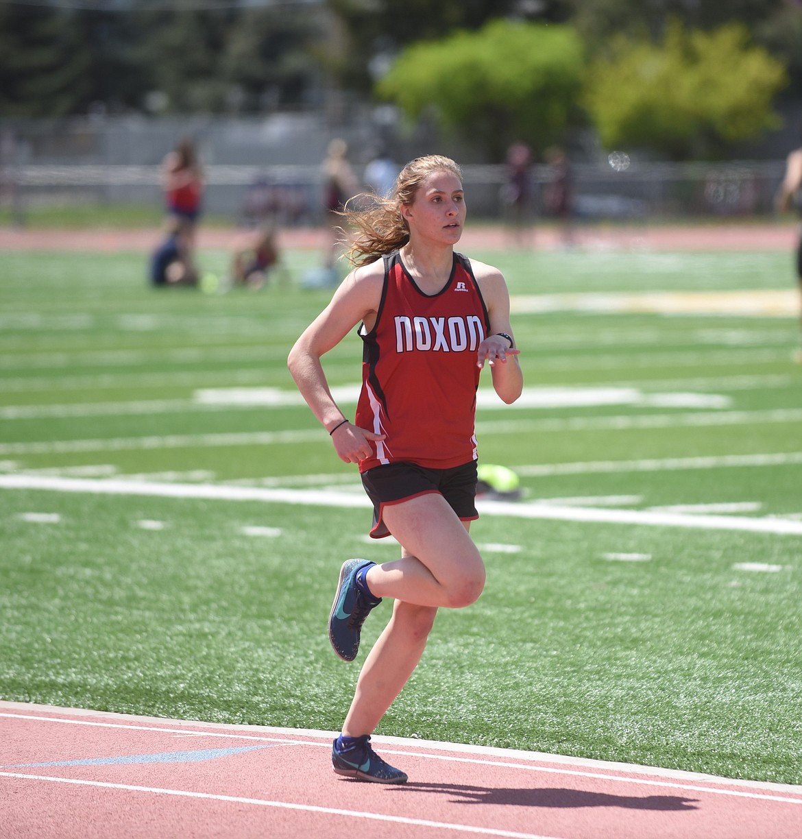 Noxon's MacKenzie Morgan cruised to a win in the 800-meter run Friday at the 14-C District championship at Missoula County Public School stadium. Morgan enjoyed a dominant day with wins in the 400- and 3,200-meter runs. (Scott Shindledecker/Valley Press)