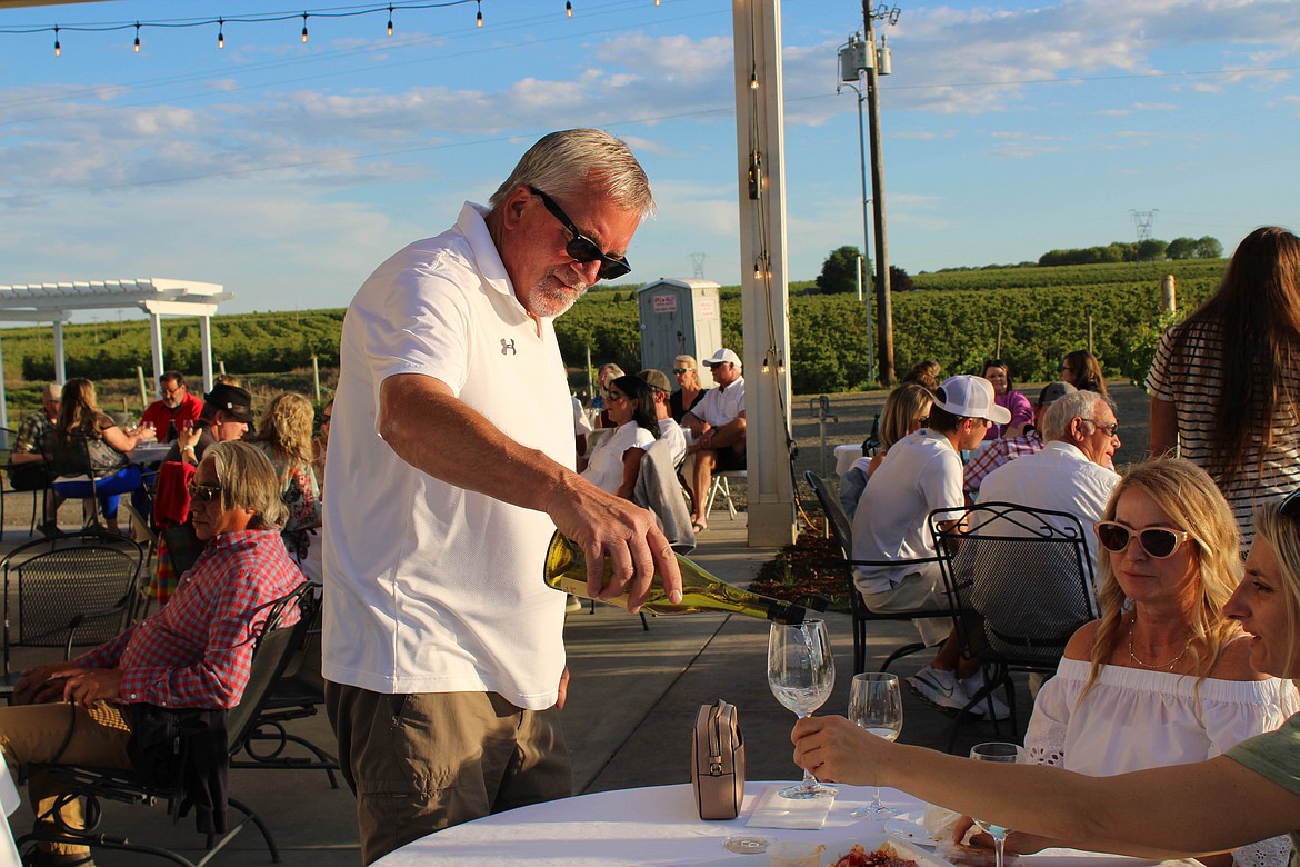 Beaumont Cellars Winery owner Pete Beaumont pours his 2020 chardonnay on Friday.