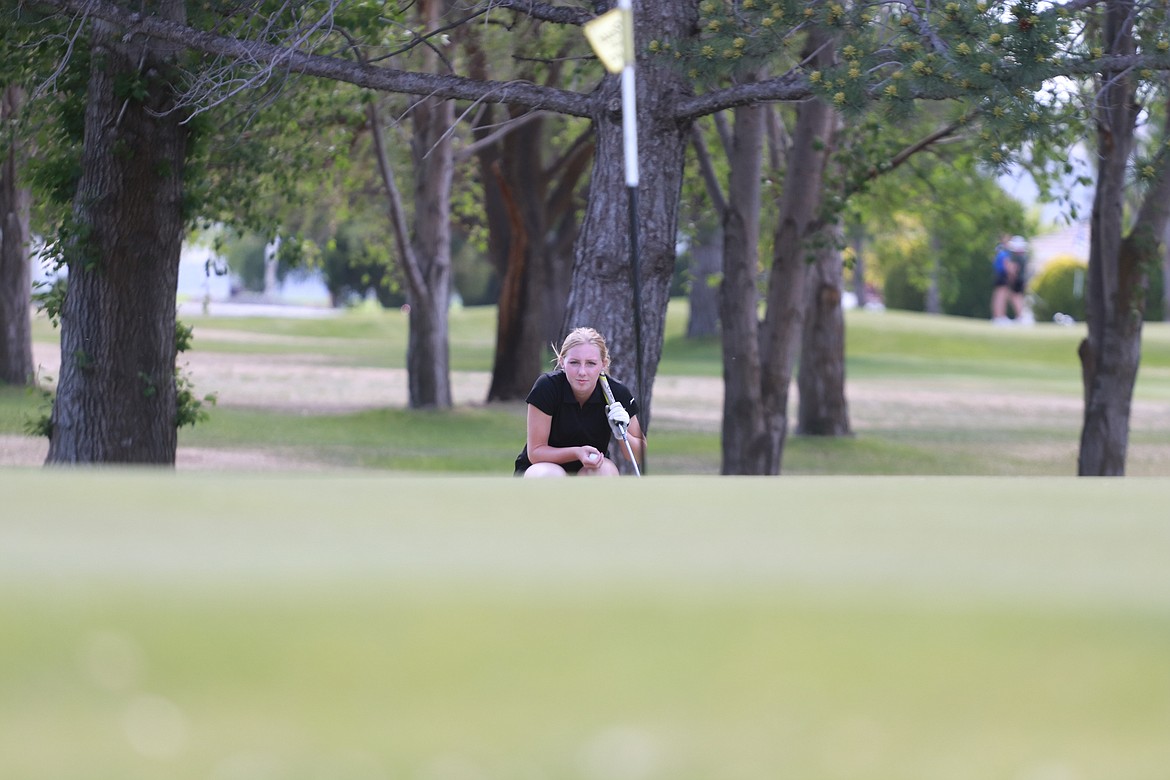 Ephrata High School's Payton Hagy zeroes in her shot from beside the green at Lakeview Golf & Country Club last Tuesday afternoon at the NCR Girls Regional Golf Tournament.