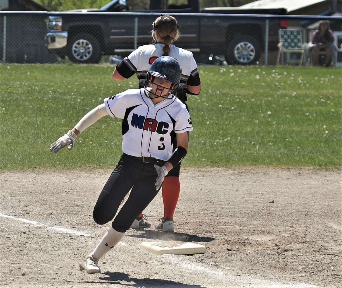 Rheid Crawford rounds third and heads home to score against Plains. (Scot Heisel/Lake County Leader)