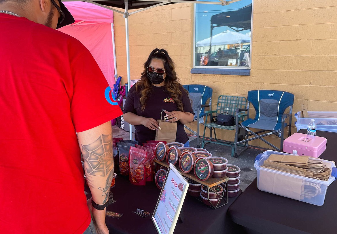 Tania Cueves of Andaluz sells salsa at the She Se Puede Pop Up on Sunday.