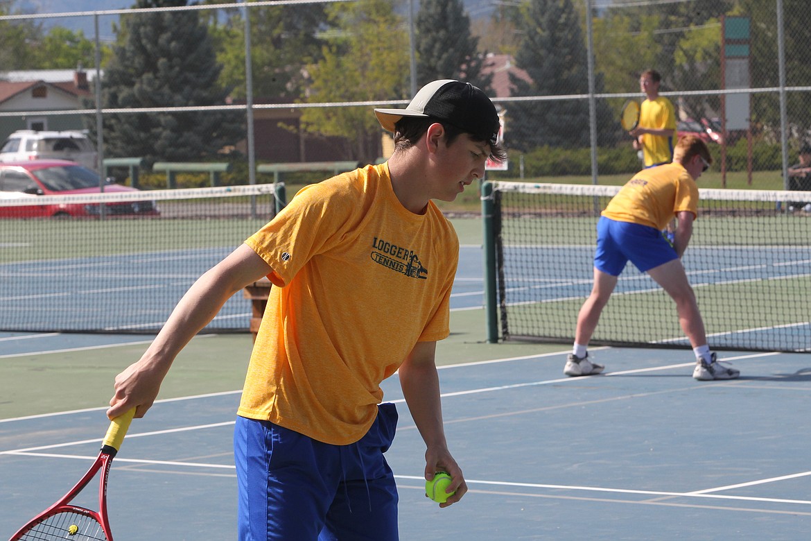 Colton Halvorson prepares to serve during a May 14 match against Columbia Falls. (Will Langhorne/The Western News)