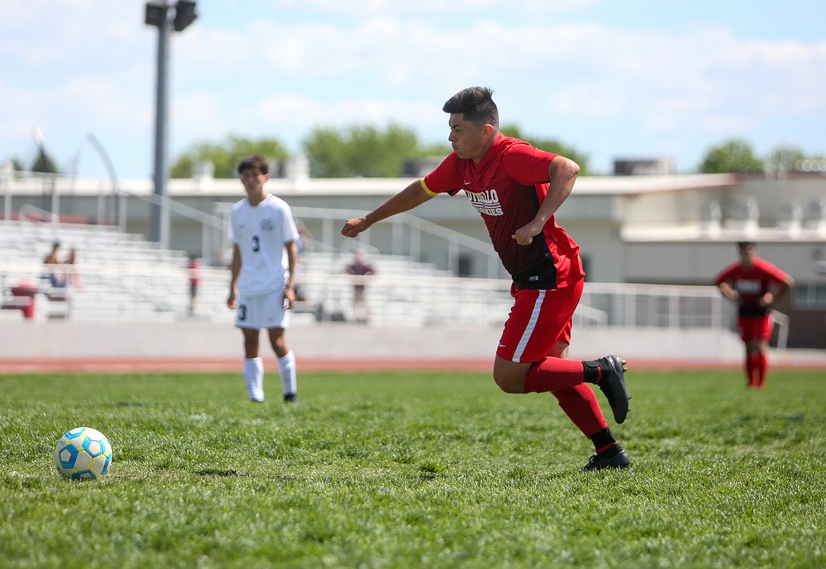 Luis Cruz runs up to take the penalty kick for Othello High School on Saturday afternoon against North Central High School in the GSL Regional Championship.