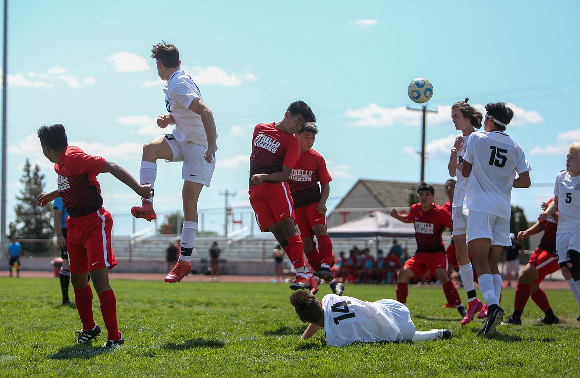 Othello's Alonzo Cruz fires a header toward the North Central High School goal off of a corner kick in extra time on Saturday afternoon in Othello.