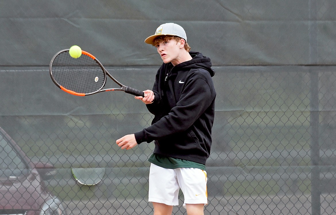 Whitefish's Aydin Mulholland hits a return in a singles match against Libby on Thursday in Whitefish. (Whitney England/Whitefish Pilot)