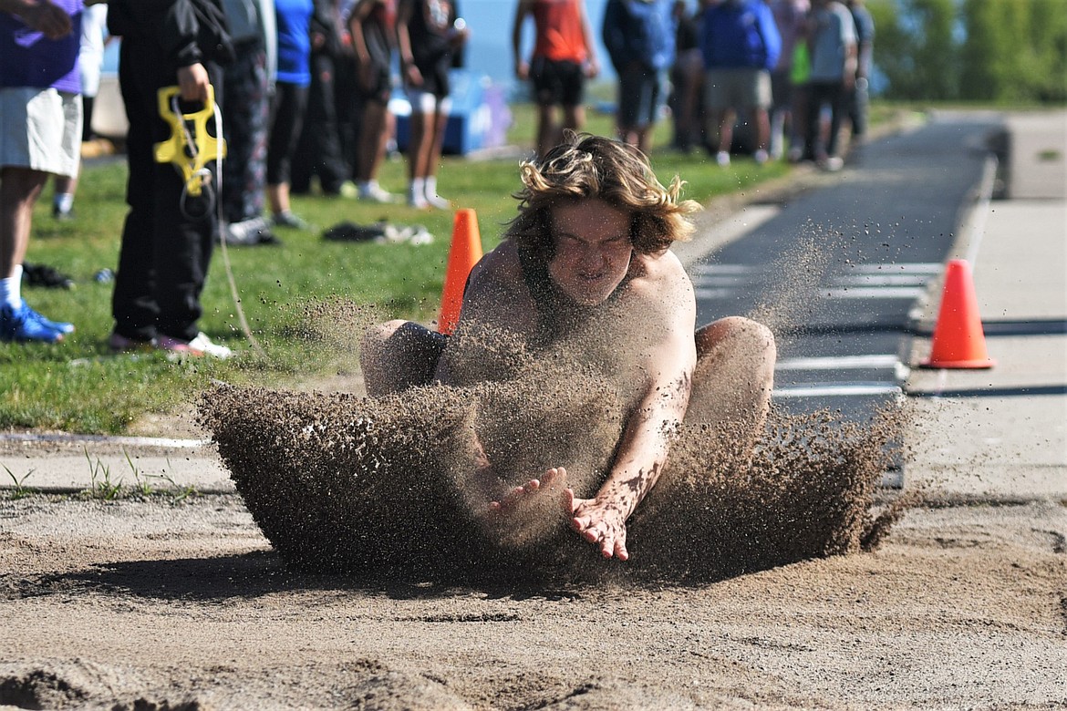 Whitefish's Ethan Schott competes in the long jump at the Whitefish-Flathead track and field dual on Thursday at WHS. (Whitney England/Whitefish Pilot)