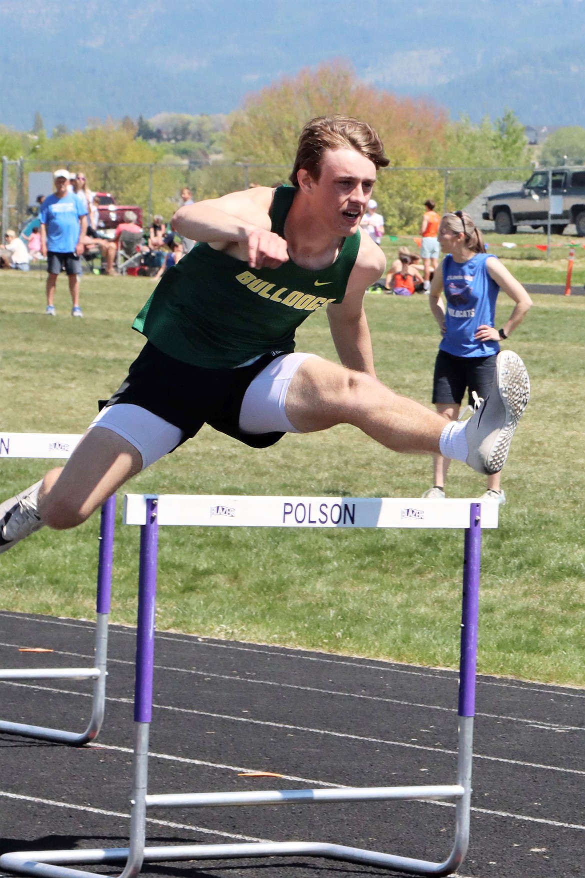 Bulldog Bodie Smith competes in the 300 meter hurdles Saturday at Polson. (Greg Nelson photo)