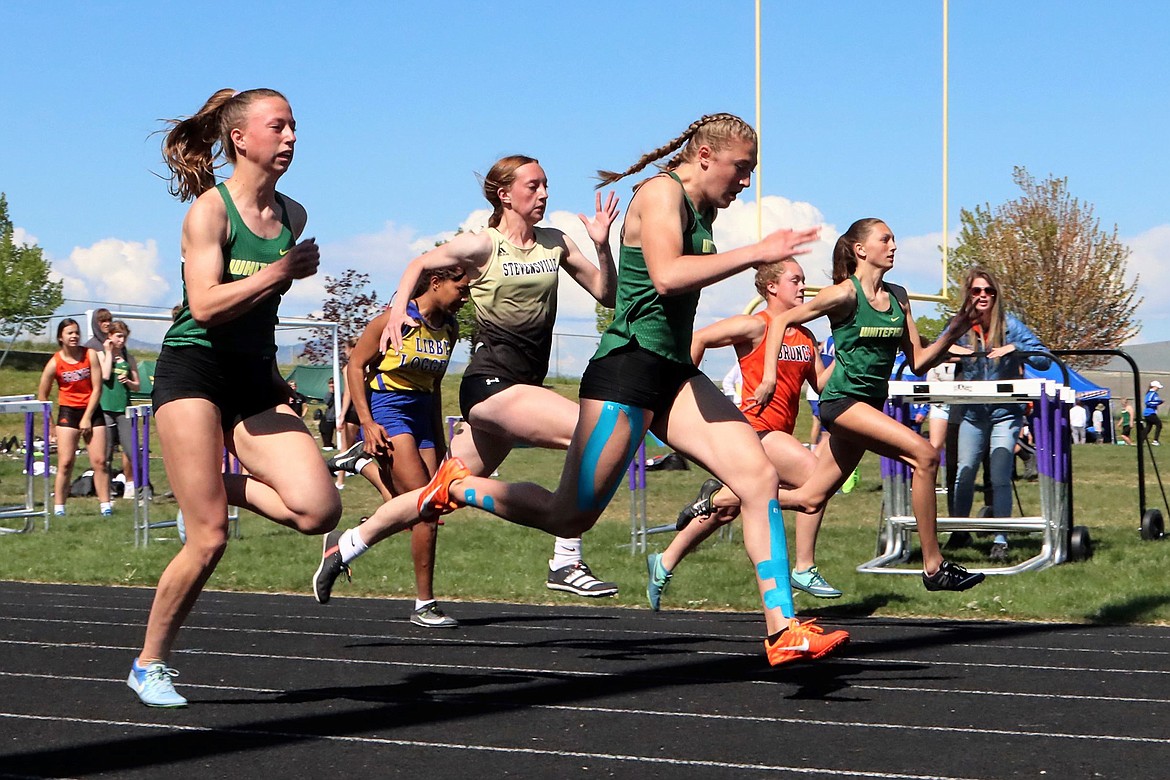 Bulldogs Mikenna Ells, Brook Zetooney and Erin Wilde run in the 100 meter dash. (Greg Nelson photo)