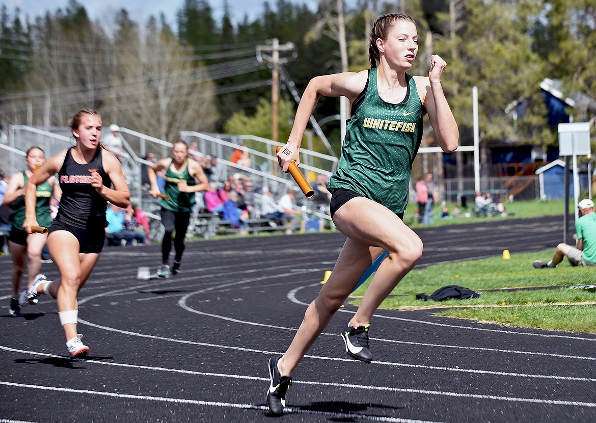 Lady Bulldog Hailey Ells takes off at the start of the girls 4X100 relay at the Whitefish-Flathead track dual on Thursday at WHS. (Whitney England/Whitefish Pilot)