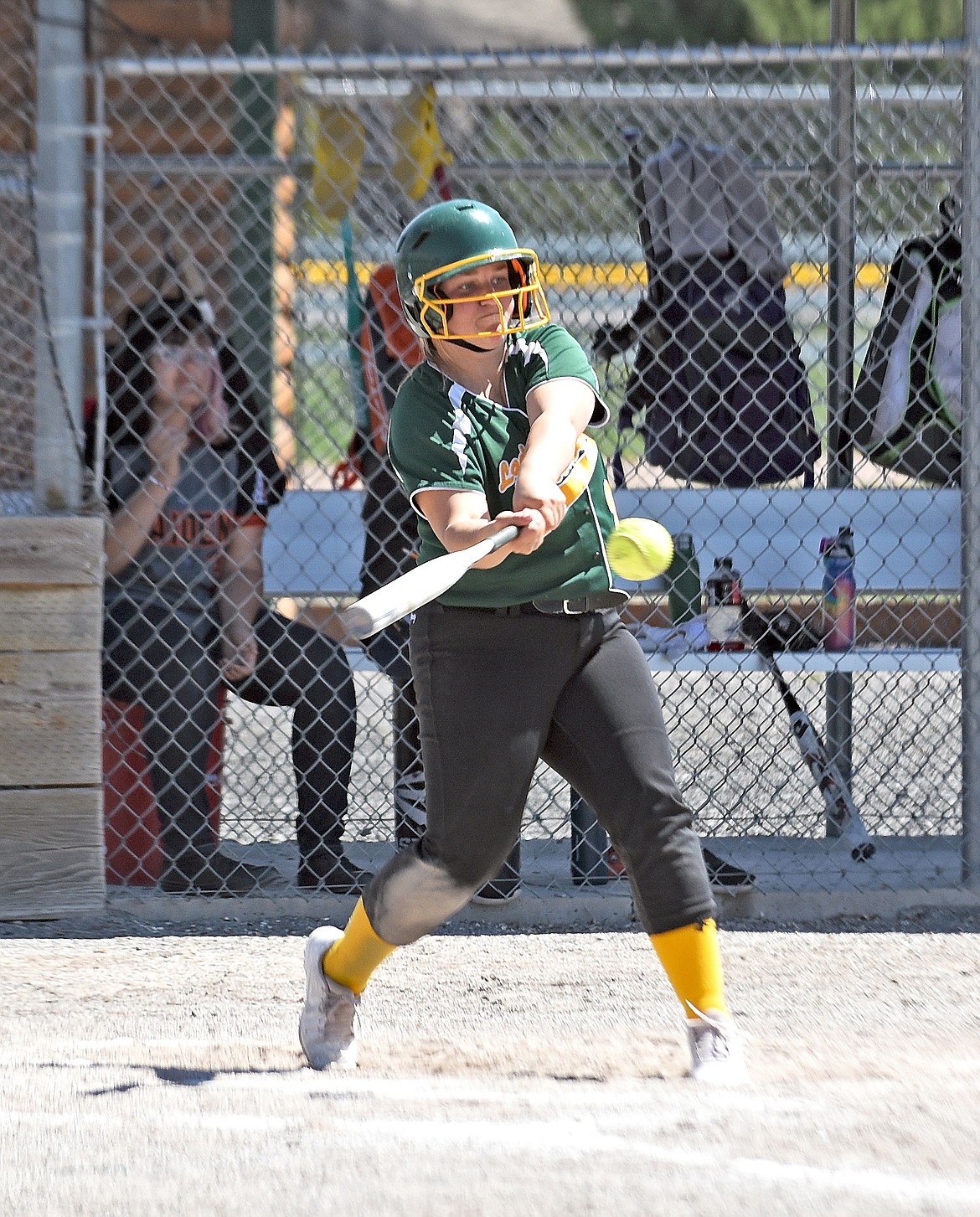 Whitefish senior Ashton Ramsey lines up a hit while batting in a softball game against Ronan on May 6 in Whitefish. (Whitney England/Whitefish Pilot)