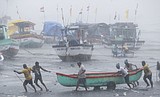 Powerful cyclone hits land in India amid deadly virus surge
