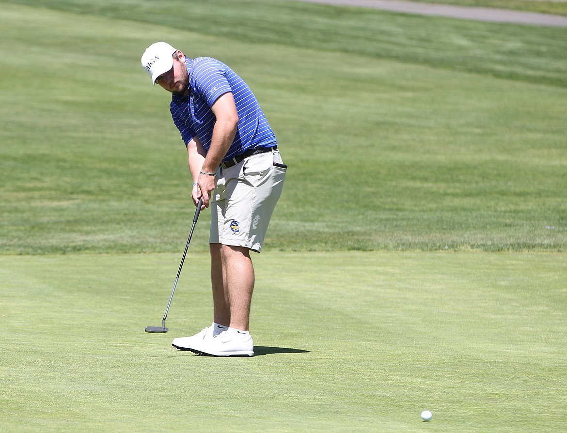 MARK NELKE/Press
Cole Jaworski of Coeur d'Alene putts on the ninth green in the first round of the state 5A golf tournament at Avondale Golf Club in Hayden Lake.