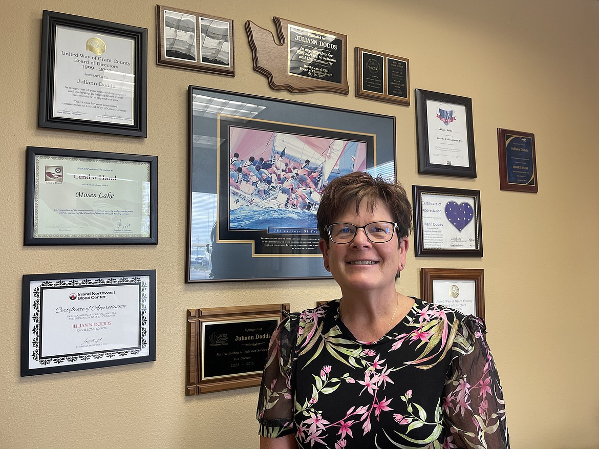 Juliann Dodds, senior Vice President and commercial banking manager for Banner Bank in Moses Lake, with some of the many awards and community recognition certificates she has received over the years. Dodds is a current board member and former president of the Grant County Economic Development Council.