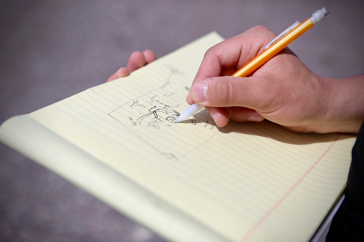 A student sketches out the scene during the forensics class final at Bigfork High School last Friday, May 14.
Mackenzie Reiss/Bigfork Eagle