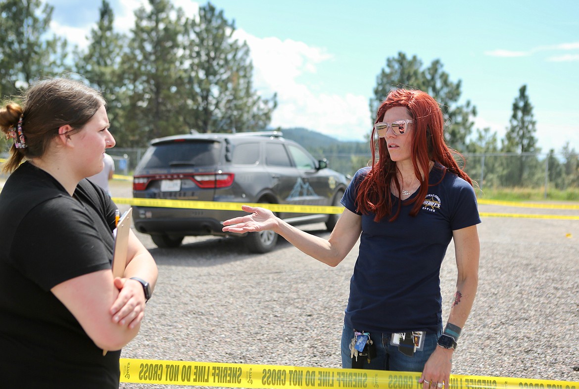 Crime Scene Team Leader Kate Mason gives pointers to a student during a forensics class exercise on Friday, May 14.
Mackenzie Reiss/Bigfork Eagle