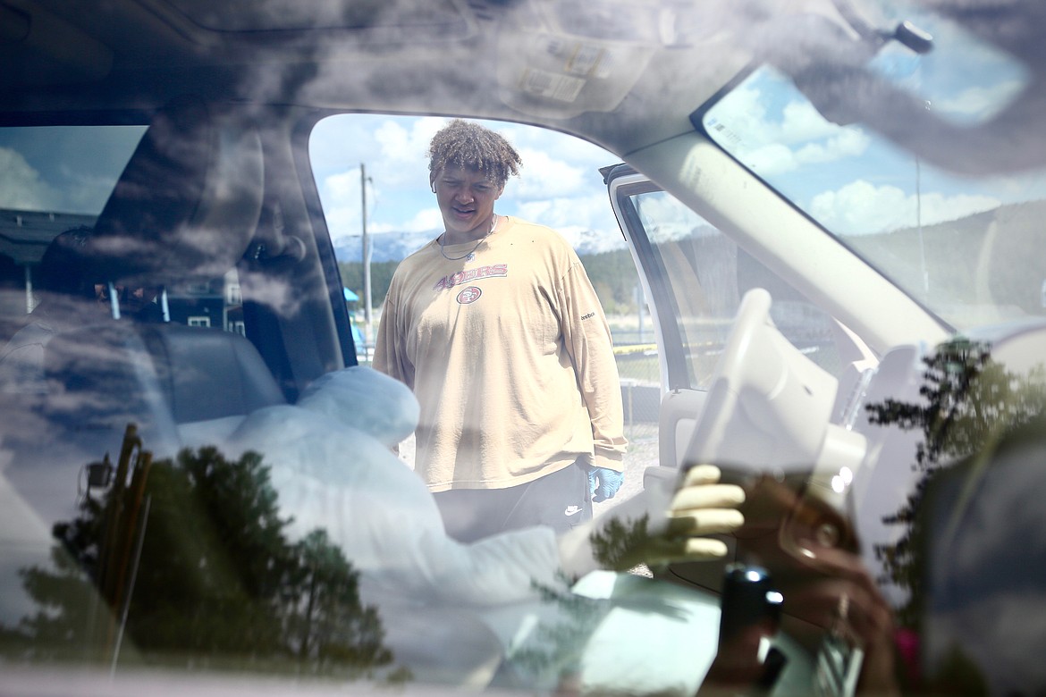 A student takes a peek inside a vehicle where a fake body was placed during a mock crime scene investigation at Bigfork High School.
Mackenzie Reiss/Bigfork Eagle