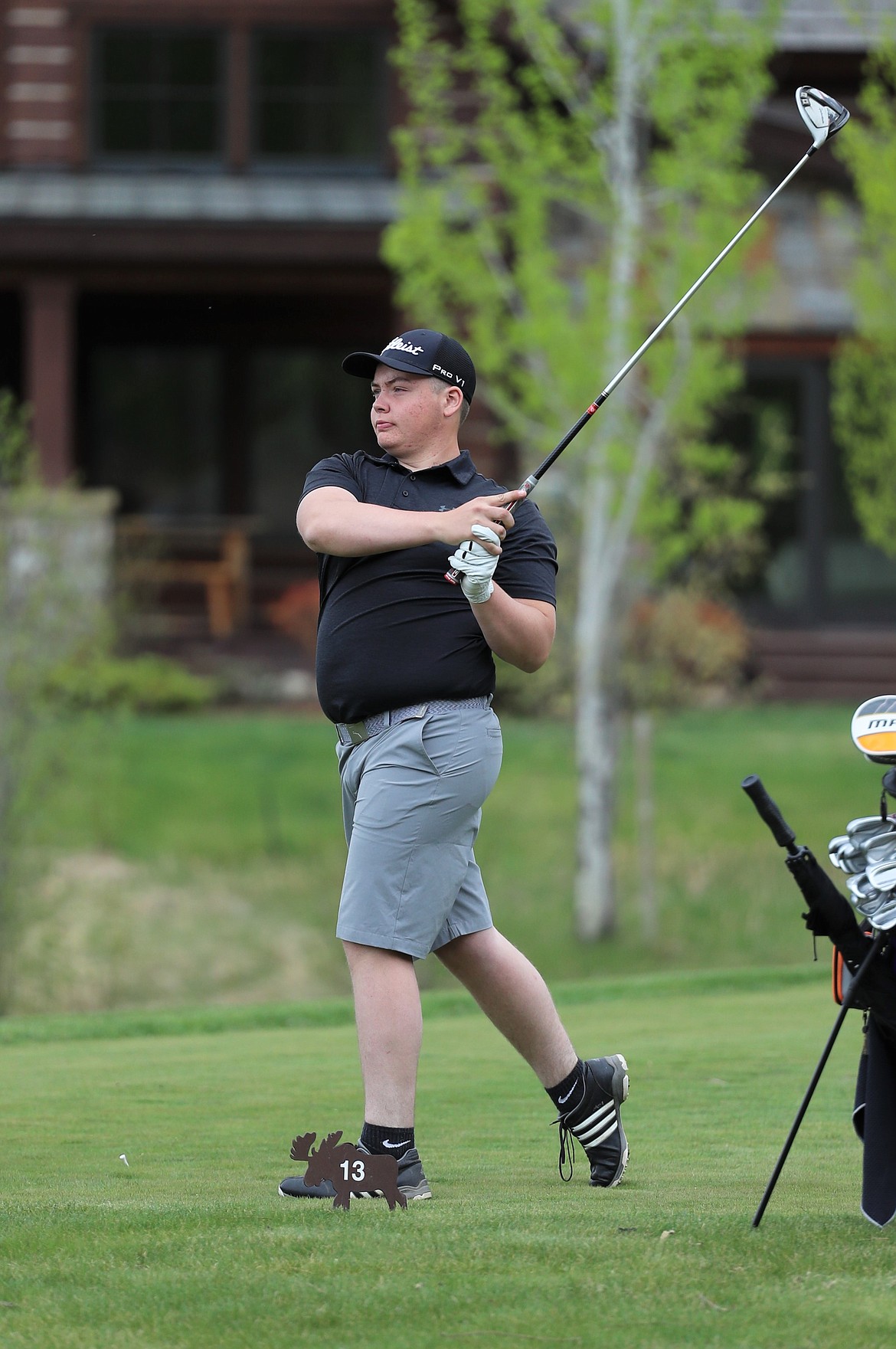 Kameron Salesky holds his follow through on a tee shot during the Sandpoint Invitational on May 3 at The Idaho Club.