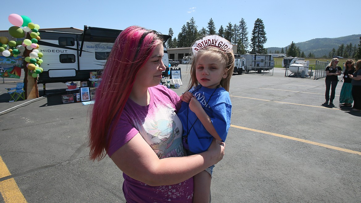 Mom Berkley and 4-year-old Willow Leavitt celebrate Willow's birthday Monday during a Make-A-Wish Idaho wish reveal at Blue Dog RV in Post Falls. Willow received a new camper and lots of fun activities and supplies to go with it.