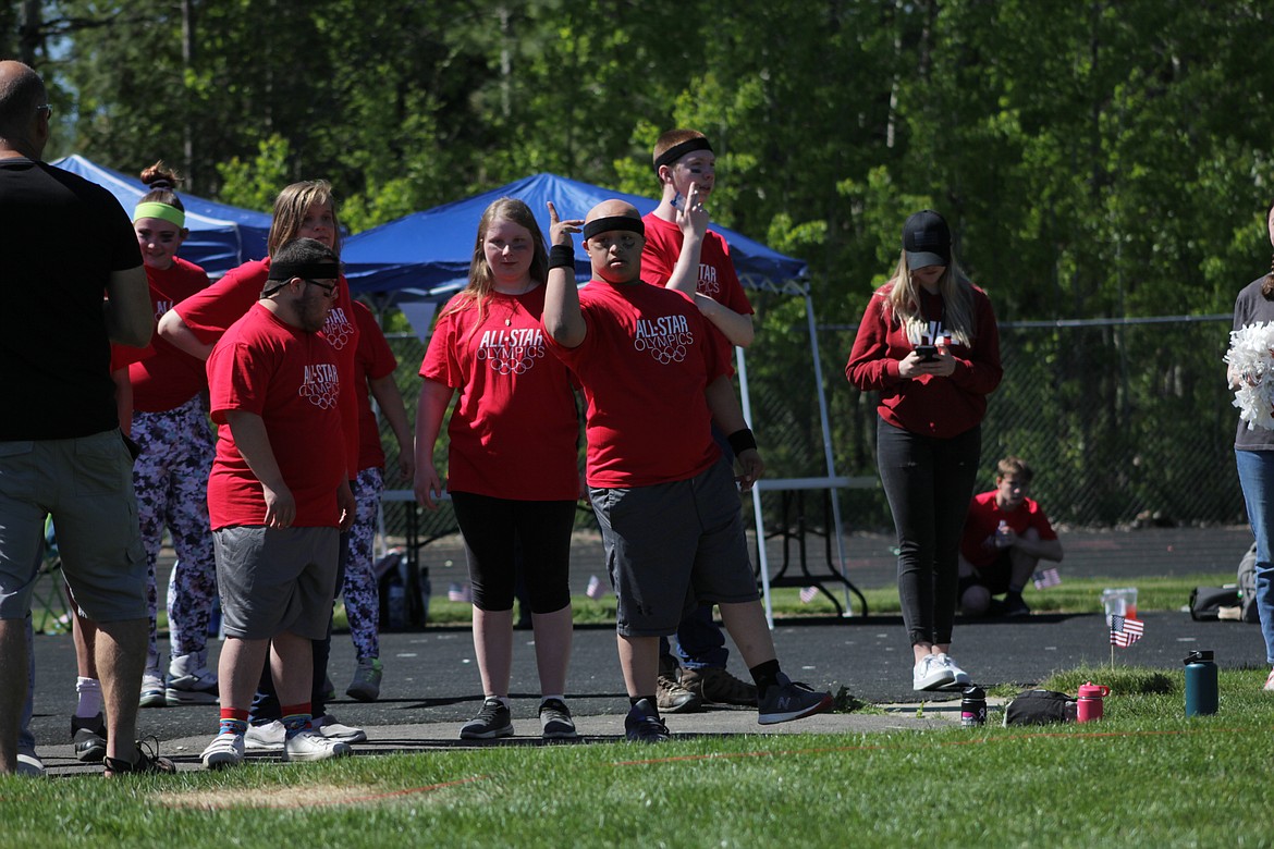 Left to right: Kevin Collins, Dharma Crawford, Corban Caralis and William Griffin prepare for shot put.