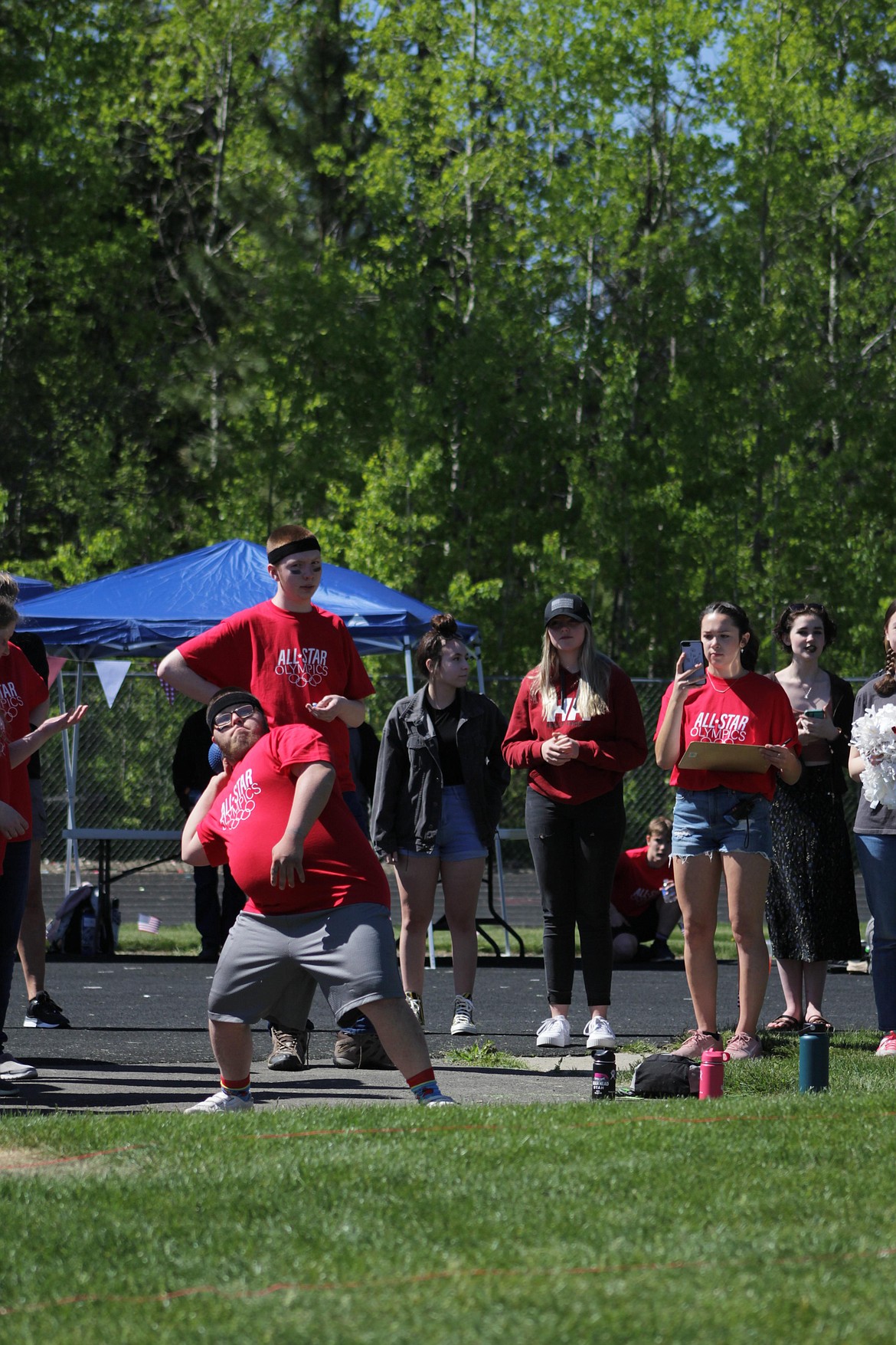 Kevin Collins throws during shot put.