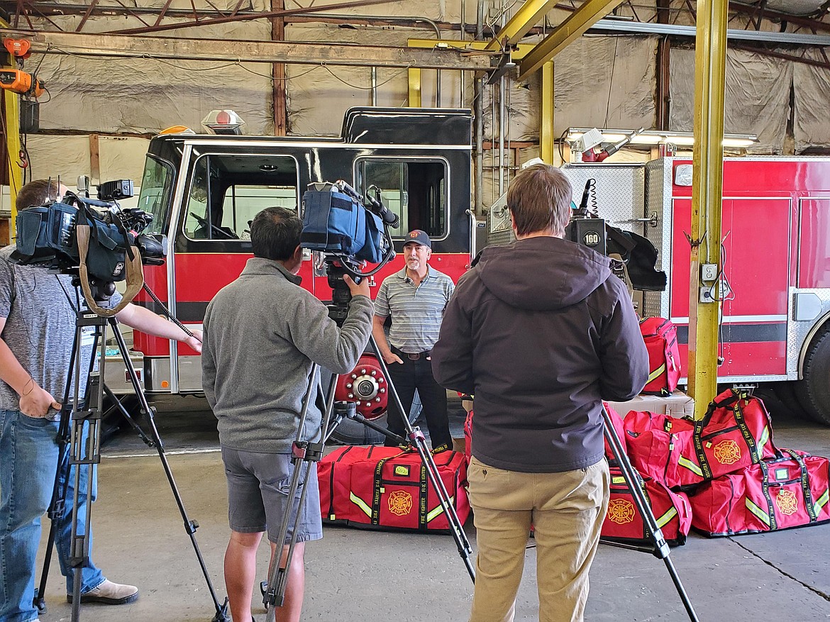 East Priest Lake Fire District officials talk to the media after the new fire district was selected to receive a $27,000 grant by the Gary Sinise Foundation. The grant will pay to provide critical fire kit and incident gear turnouts to volunteers.