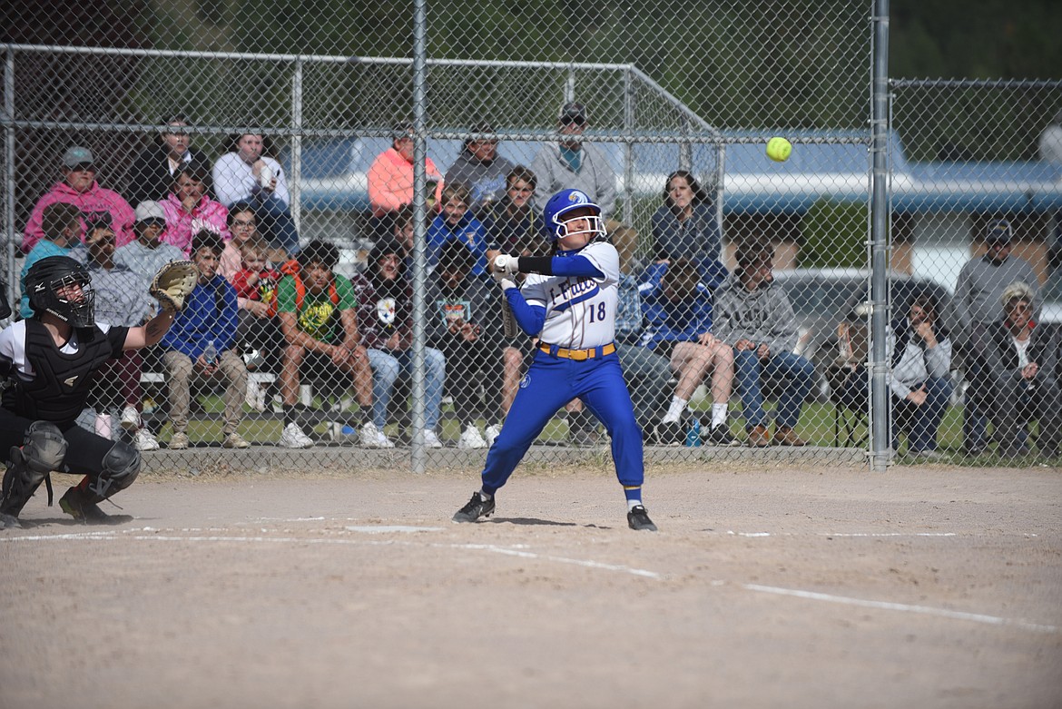 Thompson Falls centerfielder Olivia Harnett watches a pitch against Plains last week. Harnett made a running catch in deep centerfield to help the Lady Hawks win. (Scott Shindledecker/Valley Press)