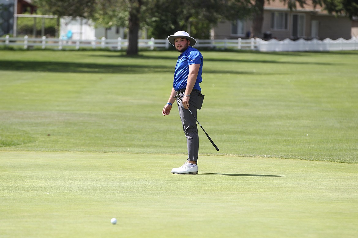MARK NELKE/Press
Coeur d'Alene junior Cole Jaworski watches his putt on the 18th hole Tuesday in the final round of the state 5A golf tournament Tuesday at Avondale Golf Club in Hayden Lake.