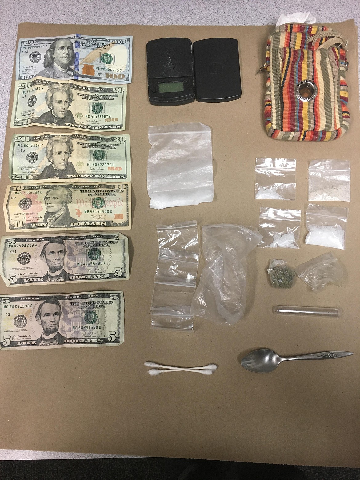 Cash and other evidence was seized from a woman arrested on suspicion of methamphetamine possession Thursday.