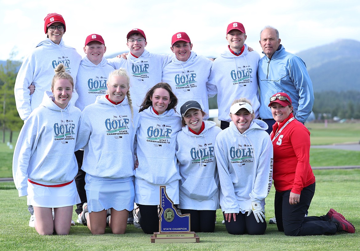 The Sandpoint golf team poses for a photo with the state trophy following the girls first-place finish on Tuesday at The Links.