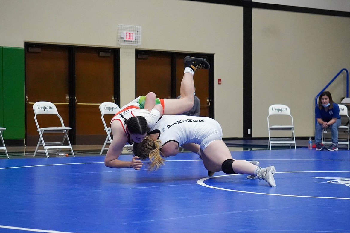 Avery Ackerman (beneath) slams her opponent to the mat at the Women’s Junior College National Championship over the weekend.