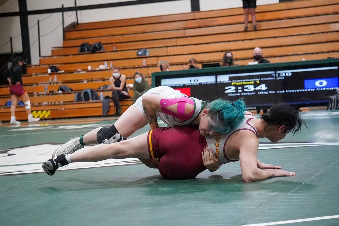 Big Bend’s Cora Orton (above) looks for a takedown in her match on Friday at the Women’s Junior College National Championship on her way to the national championship in the 130 division.