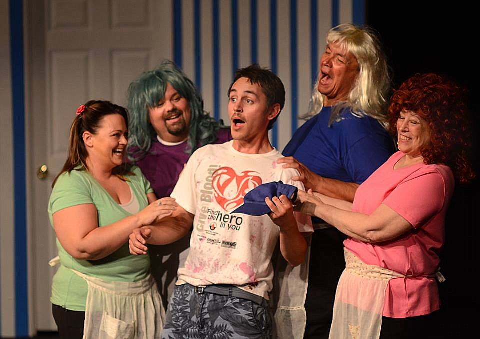 Jeff Ames, center, performs on stage at Masquers Theater in Soap Lake.