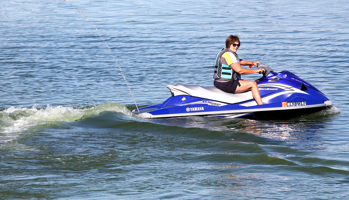 A jet skier takes to Moses Lake in September 2017. The Moses Lake Irrigation and Rehabilitation District, which ordinarily sprays the lake for noxious weeds, may have to change its timetable to accommodate the state Department of Fish and Wildlife this year.