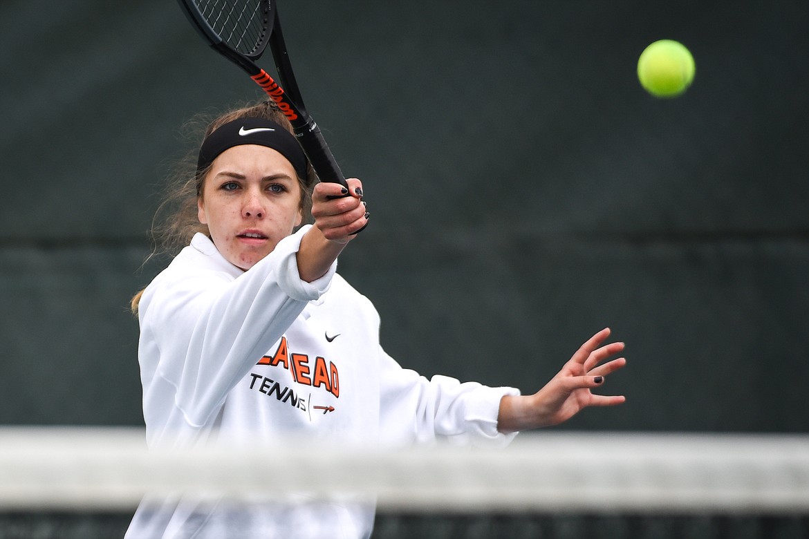 Flathead's Emma Hawkins hits a return in a Round 1 match with Great Falls' Brooke Dailey during the Northern AA Divisional Tennis Tournament at Flathead Valley Community College on Thursday. (Casey Kreider/Daily Inter Lake)