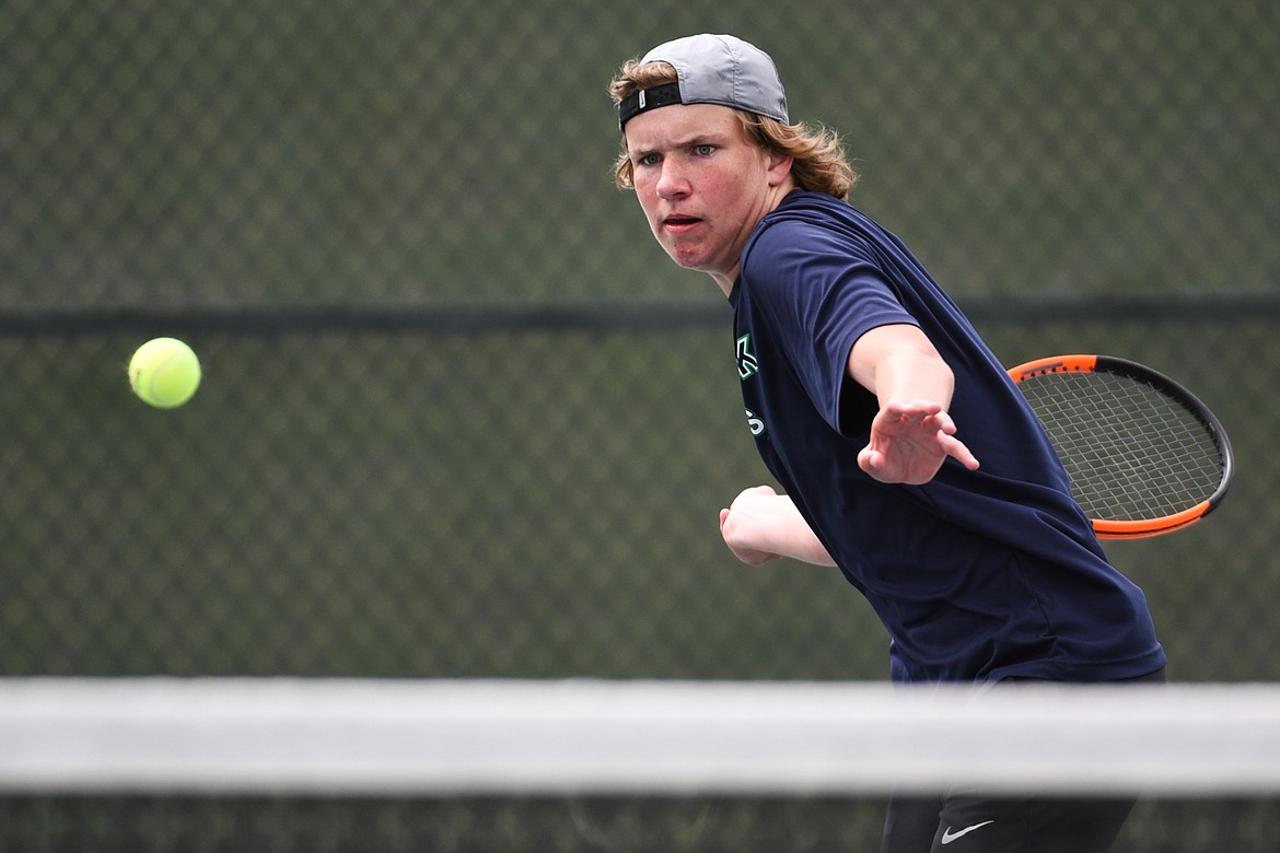 Glacier's Rory Smith eyes a return in a Round 1 match against C.M. Russell's Kade Haverlandt during the Northern AA Divisional Tennis Tournament at Flathead Valley Community College on Thursday. (Casey Kreider/Daily Inter Lake)