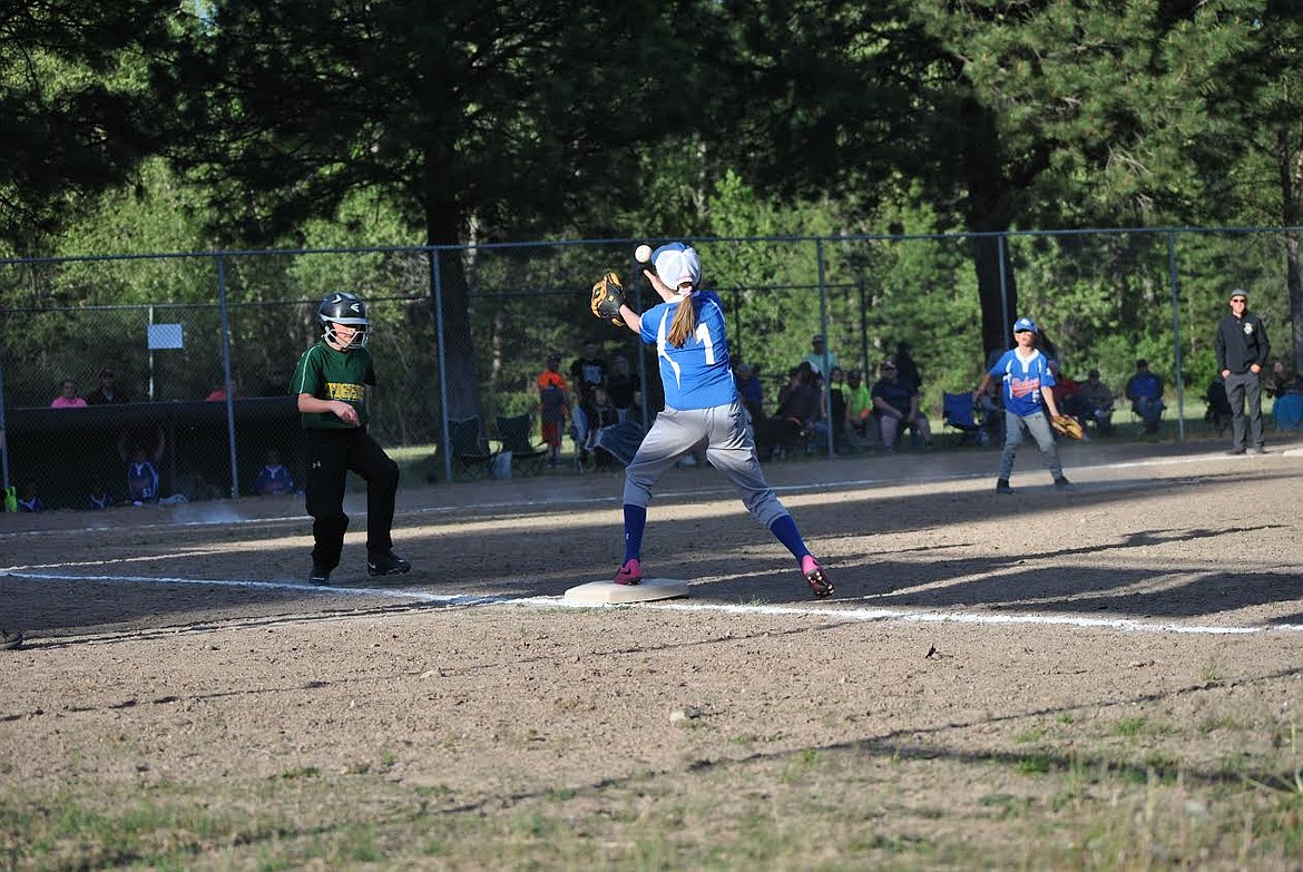 Mady Neu made a quick play at first base Tuesday night in St. Regis when the Superior Minor's played against the Tigers. Austyn Hotchkiss had a nice hit but wasn't quite able to make it on base. (Amy Quinlivan/Mineral Independent)