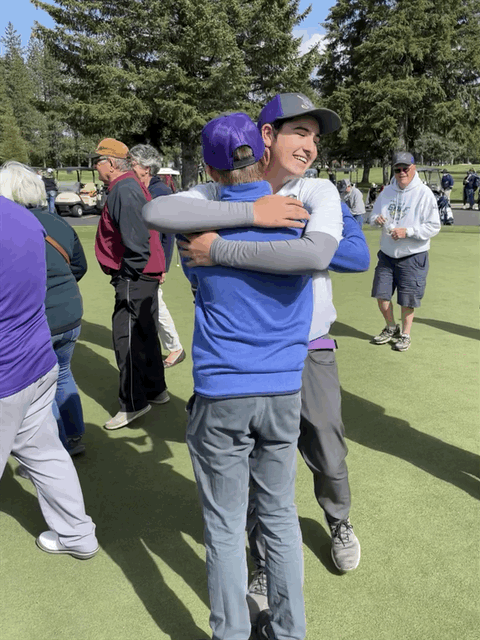 Archie Rauenhorst and Stephen Paul embrace after Kellogg found out that they had won the 3A State Golf Championship.