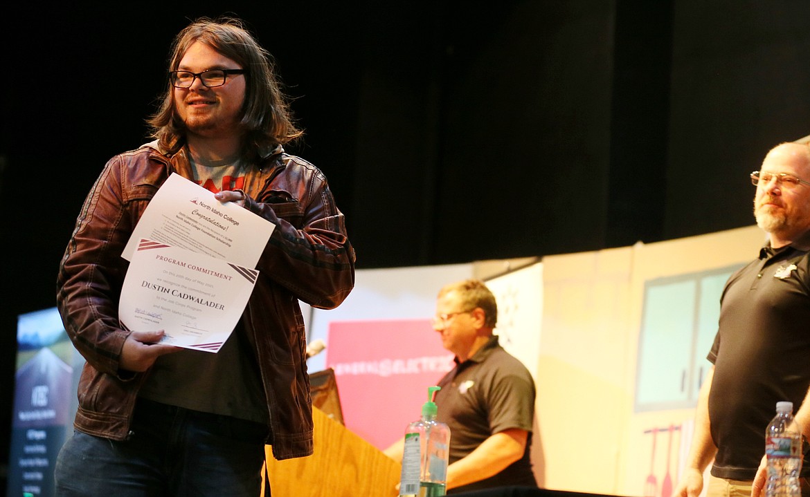 Mountain View Alternative High School senior Dustin Cadwalader looks out at the audience after committing to enroll in North Idaho College's Job Corps program during a signing ceremony Thursday. Dustin was one of the seniors who received a $1,000 scholarship.